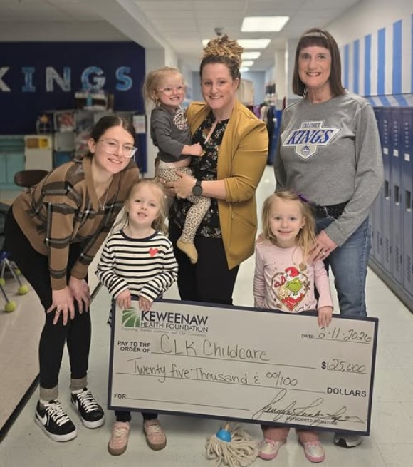CLK Childcare Donation group photo with check.